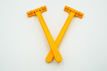 Shaving razor blades for men or women in yellow color, the object is isolated on white background