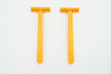 Shaving razor blades for men or women in yellow color, the object is isolated on white background