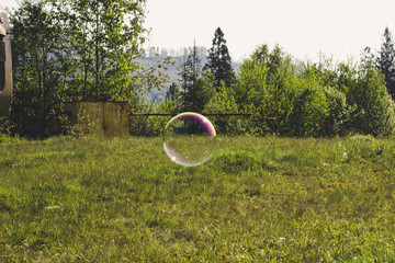 Soap bubbles on the background of the mountains.