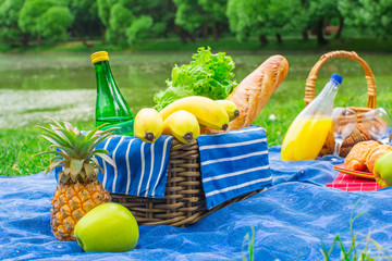 Basket with grapes and two glasses of the white wine