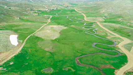 large plateau areas, water basins and habitats