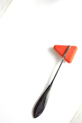 Hammer jerk for doctor uses neuro exam on white background,portrait orientation