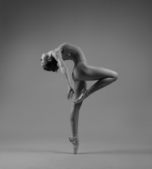Flexible ballerina in pointe bends back