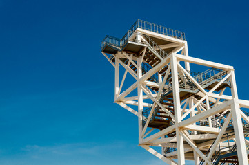 White metal frame viewing platform on the rann of kutchh against blue sky