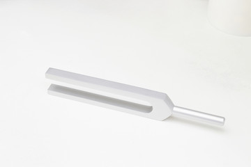 Tuning fork side arrangement on white isolated background