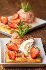 belgian waffle with strawberries on white