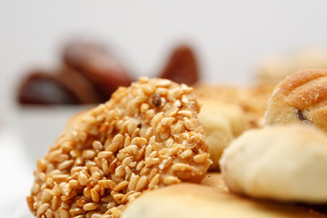 Traditional oriental cookies with sesame and dates, macro shot