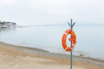 Life buoy attached to a post at the beach