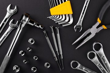 Hand tools kit on black background. Flat lay.