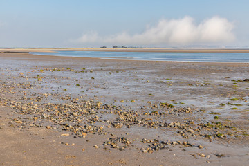 Low tide with sand and stones in Burrow beach