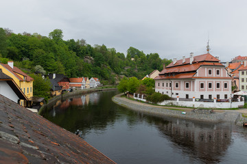 Fototapeta na wymiar Panoramic landscape view on river Vltava in the historic city of Cesky Krumlov with famous Church city is on a UNESCO World Heritage Site captured during spring with nice sky and clouds