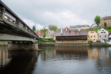 Panoramic landscape view on river Vltava in the historic city of Cesky Krumlov with famous Church city is on a UNESCO World Heritage Site captured during spring with nice sky and clouds