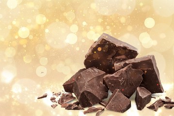 Close-up broken chocolate bar isolated on white background