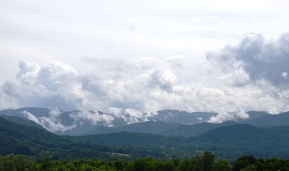 Fototapeta na wymiar landscape of the hills in the clouds