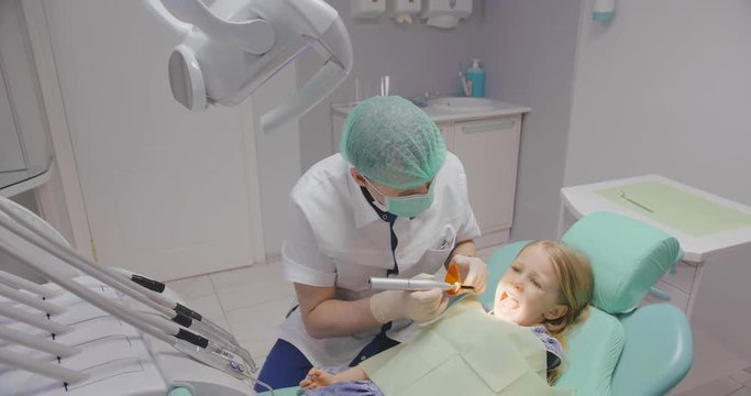 Little girl in pediatric dental clinic
