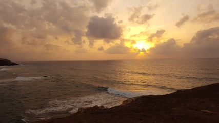 Golden sunset on the ocean beach. La Pared, Fuerteventura, Canary Islands