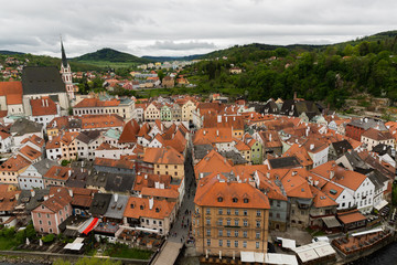 Obraz premium Panoramic landscape view above from aerial of the historic city of Cesky Krumlov with famous Cesky Krumlov Castle, Church city is on a UNESCO World Heritage Site captured during the spring