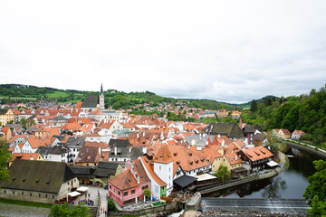 Fototapeta na wymiar Panoramic landscape view of the historic city of Cesky Krumlov during day time with famous Cesky Krumlov Castle, Church city is on a UNESCO World Heritage Site captured during spring