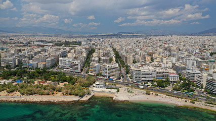 Aerial panoramic photo of famous seaside bay of Faliro with beautiful emerald sea, clouds and deep blue sky