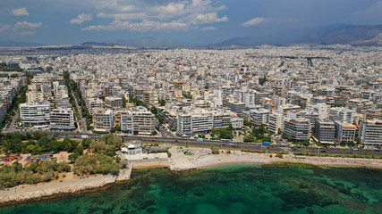 Aerial panoramic photo of famous seaside bay of Faliro with beautiful emerald sea, clouds and deep blue sky