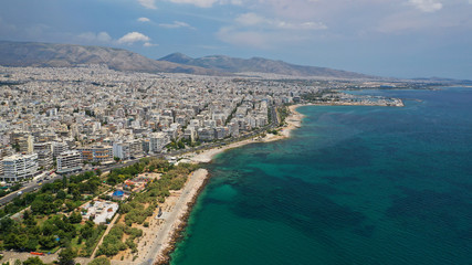 Aerial panoramic photo of famous seaside bay of Faliro with beautiful emerald sea, clouds and deep blue sky