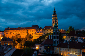 Obraz premium Panoramic landscape sunset view with blue dark sky the historic city of Cesky Krumlov with famous Church city is on a UNESCO World Heritage Site captured during spring with nice sky and clouds