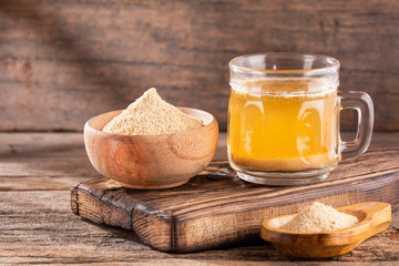 Maca root health drink in a glass with powdered - Lepidium meyenii.