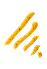 Mustard sauce. Strips of mustard on a white background.