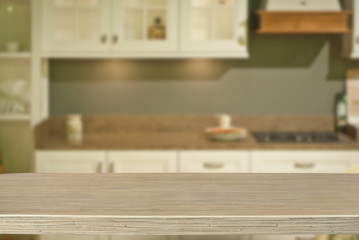 A wooden board on the background of the kitchen. An empty product board. Sharpness in the foreground. Empty space for goods.