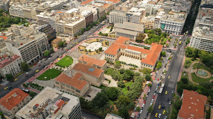 Fototapeta premium Aerial photo of famous landmark buildings of Academy of Athens, Panepistimio and public Library, Athens, Attica, Greece