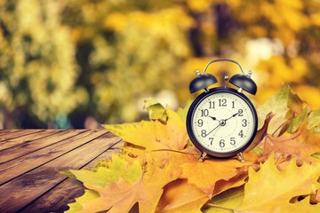 Retro alarm clock on table  background