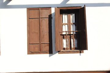 Wooden window on the white wall