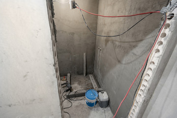 The basis of shower cabin. Bathroom during finishing work. Laying tiles on the wall and floor. Home...