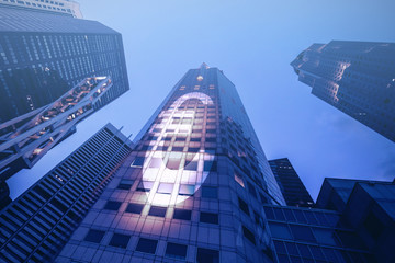 Fototapeta na wymiar Bottom view of modern skyscraper in the twilight. Business district