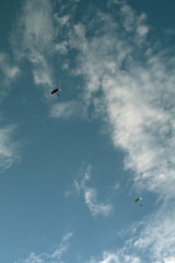 flying in the sky,motorized paraglider,blue, fly, paragliding, flying, sport, clouds,freedom, air, extreme, adventure,high, glider,flight,  