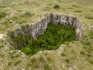 Close to Duvno Polje (Duvanjsko polje) of western Bosnia and Herzegovina is a series of steep of...