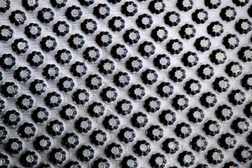 dark shiny plastic background, star pattern