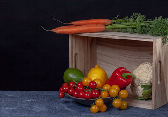 Composition of vegetables on dark cement background. Black background with copy space. Organic...