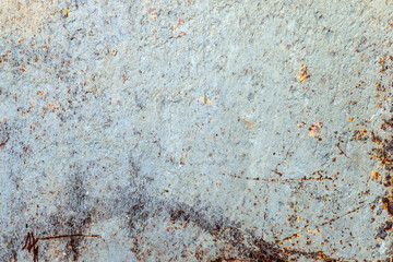 grunge background: rough painted metal sheet with lots of rust stains, scratches