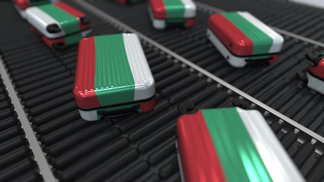 Many travel suitcases featuring flag of Bulgaria on roller conveyer. Bulgarian tourism conceptual animation