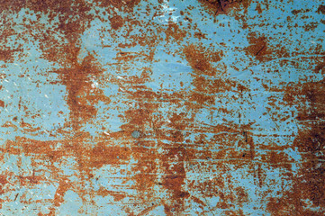 grunge background: rough painted metal sheet with lots of rust stains, scratches