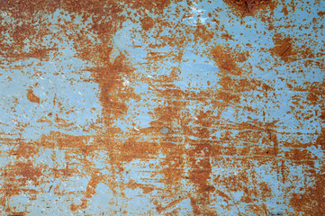 grunge background: rough painted metal sheet with lots of rust stains, scratches