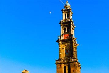 Fototapeta na wymiar wester church amsterdam daytime with the moon in the background