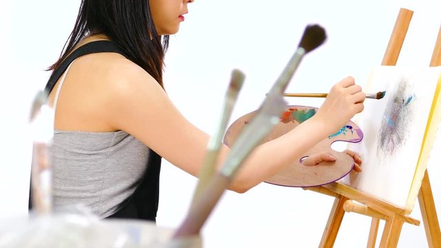 Anonymous artist painting at easel
