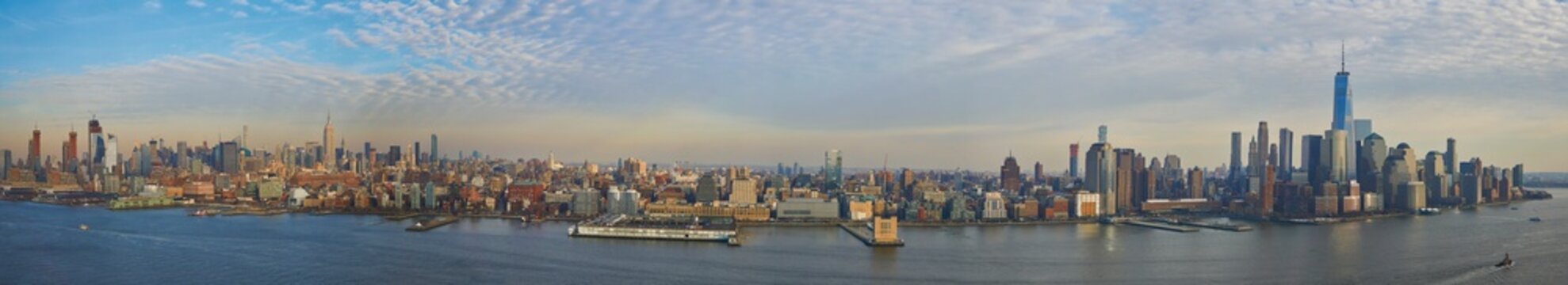 Ultra wide panorama of Manhattan skyline showing downtown financial district and midtown up to central park
