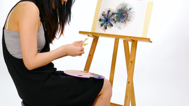 Anonymous artist chooses paints