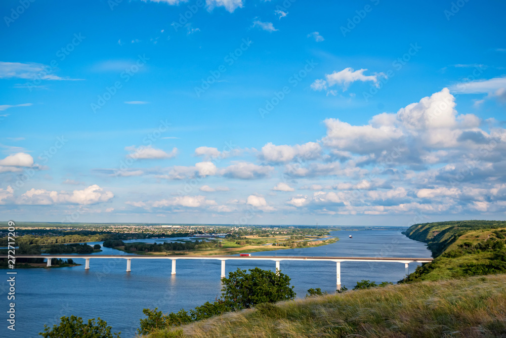 Wall mural view of steppe and a modern bridge over upper river don in russia