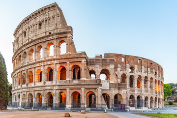 Colosseum, or Coliseum. Illuminated huge Roman amphitheatre early in the morning, Rome, Italy