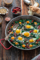 Spinack with fried eg in big iron skillet