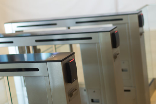 Automatic security turnstiles with card reader in a corporate office building